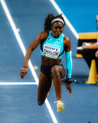 Charisma Taylor competing in the triple jump for The Bahamas